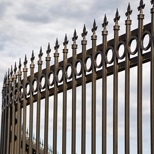curved metal fence with spikes